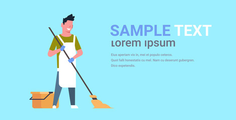 man in gloves and apron washing floor guy using mop doing housework cleaning concept flat horizontal copy space blue background full length