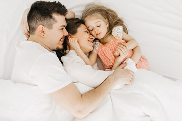  happy family in bed