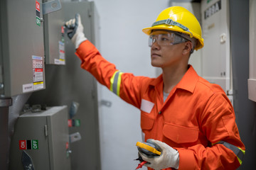 Electrician engineer working in the electricity building