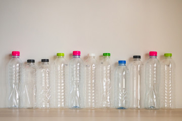 set of many plastic bottle on wood table, recycling concept