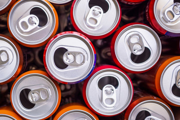Empty aluminium drink cans recycling background concept, top view closeup