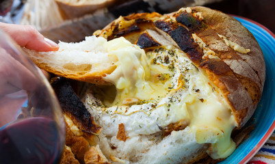 Camembert fondue in bread bowl