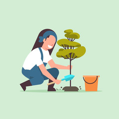female farmer planting young tree gardener woman digging soil working in garden agricultural gardening concept flat full length