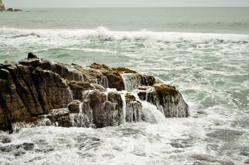 waves crashing on rocks