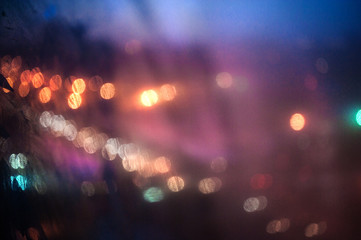 Blurry abstract background with defocused lights in the city