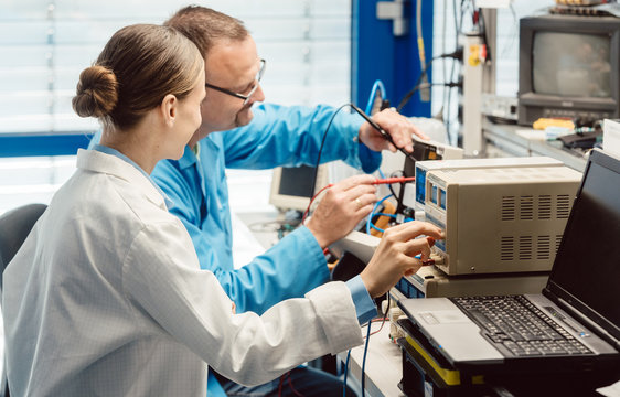 Team of electronic engineers testing a product prototype