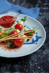 Mozzarella and tomato salad - caprese on the plate