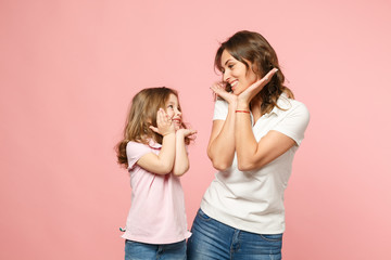 Woman in light clothes have fun with cute child baby girl. Mother, little kid daughter isolated on...