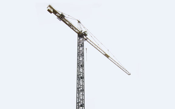 A tall construction crane in Calgary Alberta Canada working to lift heavy parts of a building which can be used as a cut out or backdrop and added onto of other images.