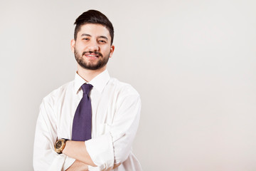 Portrait of businessman on grey background.