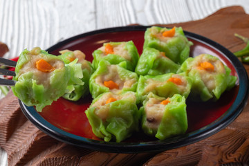 Chinese steamed pork dumpling dim sum on plate