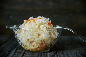 salad homemade sauerkraut in a glass jar on a table