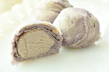 mashed taro stuffed cake half cut on plate