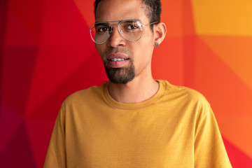 Fototapeta premium closeup portrait of black man over colorful background