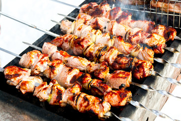 Pork skewers on skewers with an appetizing crust. Food on the coals