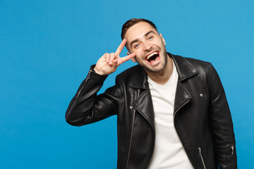 Handsome stylish young unshaven man in black leather jacket white t-shirt looking camera isolated...