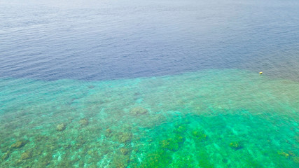 Fototapeta na wymiar Beautiful nature of blue sea sand and Turquoise color water waves at Atauro Island, Timor Leste