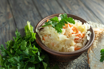 salad homemade sauerkraut in a glass jar on a table