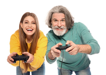 Mature man and young woman playing video games with controllers isolated on white