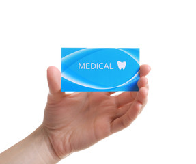 Woman holding business card isolated on white, closeup. Dental medical service