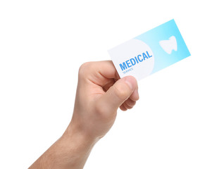 Man holding business card isolated on white, closeup. Dental medical service