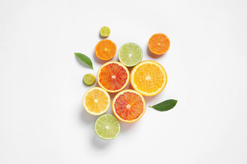 Fototapeta na wymiar Composition with different citrus fruits on white background, top view