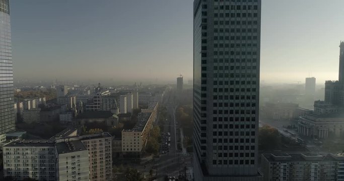 Drone footage of skyscrapers and apartment blocks in the city center of Warsaw.
