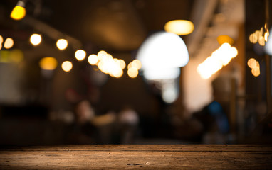 blurred background of bar and dark brown desk space of retro wood