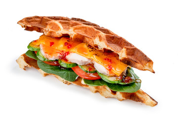 Waffle sandwich with Turkey, cheese and salad. On a white background