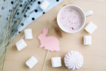 Fresh strawberry milkshake with marshmallows, close-up. Easter concept for blog or recipe book. Creative spring flatlay, top view
