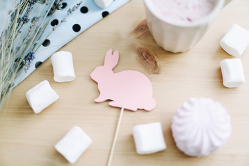 Fototapeta na wymiar Fresh strawberry milkshake with marshmallows, close-up. Easter concept. Creative spring flatlay, top view