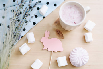 Fototapeta na wymiar Fresh strawberry milkshake with marshmallows, close-up. Easter concept for blog or recipe book. Creative spring flatlay, top view