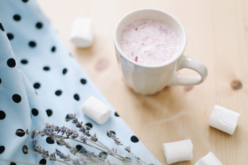 Fresh strawberry smoothie or milkshake with marshmallows, close-up. Creative summer flatlay, top view