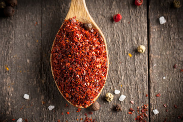 Spices in Wooden spoon. Herbs. Curry, Saffron, turmeric, rosemary, cinnamon, garlic, pepper, anise on wooden rustic background. Collection of spices and herbs. Salt, paprika. Copy space. Top view. Ban