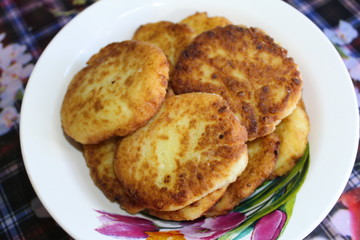 fried cottage cheese cheesecakes in a plate