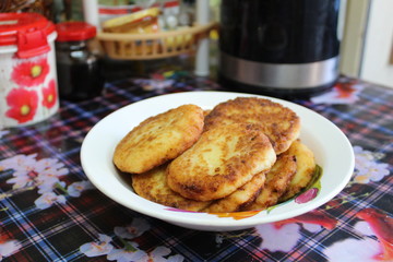 fried cottage cheese cheesecakes in a plate