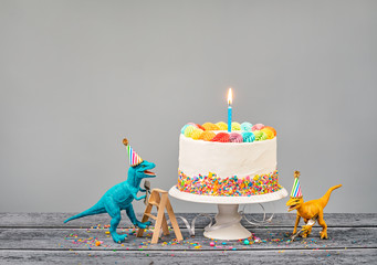 Toy Dinosaurs Eat Cake at a Birthday Party - 262306731