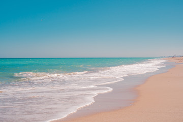 Fototapeta na wymiar Tropical beach. Sand and turquoise sea water. Beautiful beach scenery.