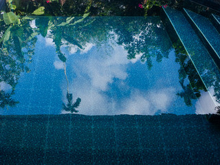 reflection palm trees in the blue pool.Koh Phangan. Thailand.