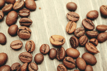 coffee beans on wooden background. view from above.