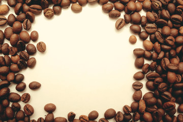 frame of coffee beans with space for text. view from above. coffee beans on a white background.