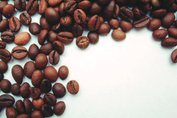 frame of coffee beans with space for text. view from above. coffee beans on a white background.