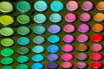 Multicolored Eye-Shadow On Black. Beauty, Fashion And Make-Up Background. Decorative Cosmetics For Make Up.