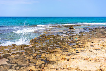 Wave splashing on the cliff