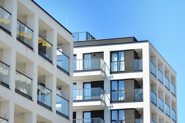 Modern apartment buildings on a sunny day with a blue sky. Facade of a modern apartment building