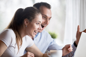 Overjoyed man and woman happy to get good news