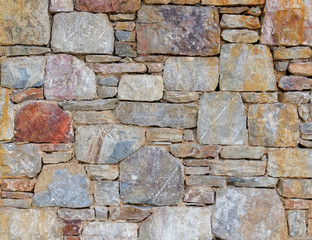 colorful stonewall close up, seamless natural background