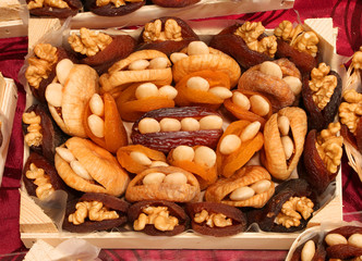 dried fruits with walnuts in the small basket for sale at local