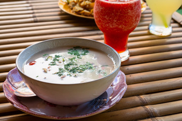 Thai Dishes - Tom Yam Kung. Spicy Shrimp Soup with Coconut milk, Lime and Seafood