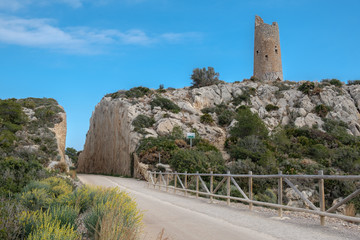 Via Verde near Benicassim in Spain with rocks and derelict tower